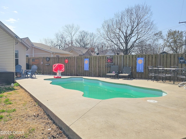 view of pool featuring a patio area, a fenced in pool, and a fenced backyard