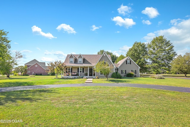 view of front facade with a porch and a front lawn