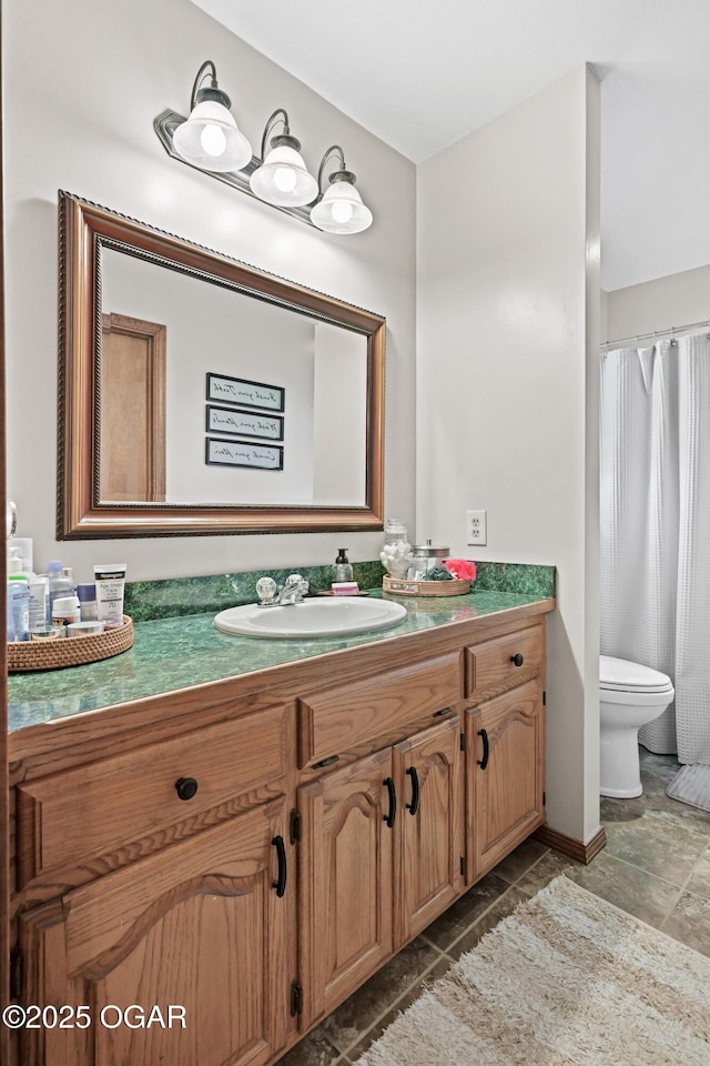 full bathroom with vanity and toilet