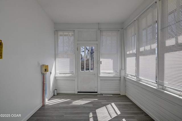 unfurnished sunroom featuring a wealth of natural light