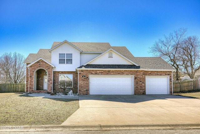 traditional-style house featuring brick siding, fence, roof with shingles, a garage, and driveway