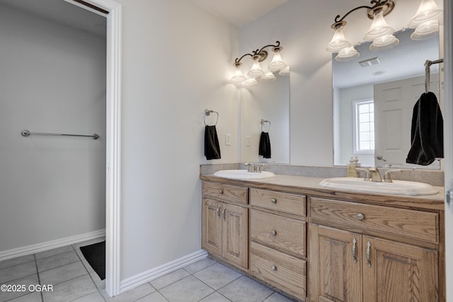 full bathroom featuring tile patterned floors, double vanity, and a sink