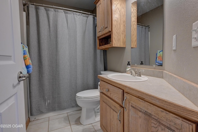 full bathroom with tile patterned flooring, a shower with shower curtain, toilet, and vanity