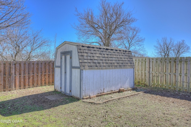 view of shed with a fenced backyard