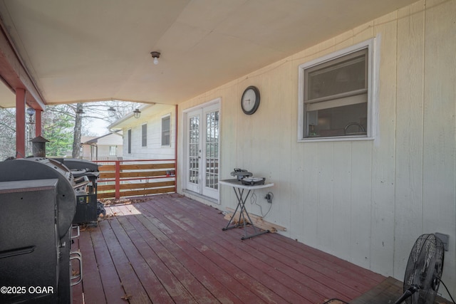 wooden terrace featuring french doors and area for grilling