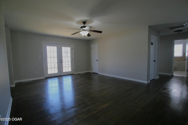 unfurnished room featuring dark wood finished floors, visible vents, french doors, and a ceiling fan