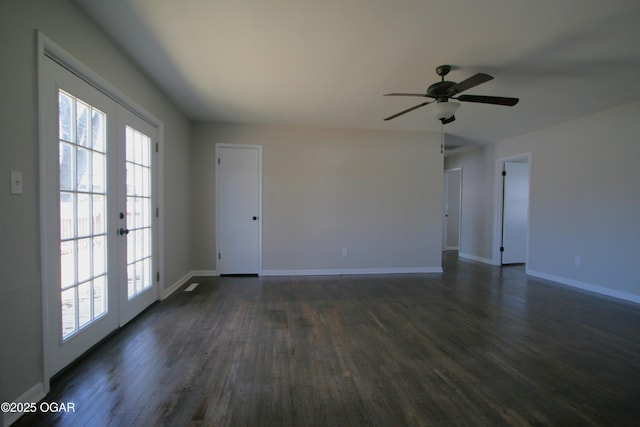 unfurnished living room with baseboards, dark wood finished floors, and a ceiling fan