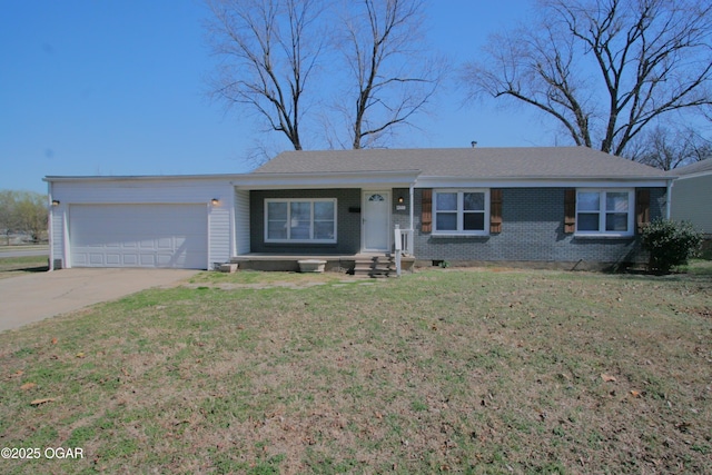 single story home with brick siding, an attached garage, driveway, and a front yard