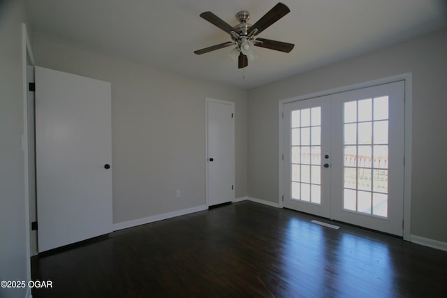 spare room with ceiling fan, french doors, dark wood-style flooring, and baseboards