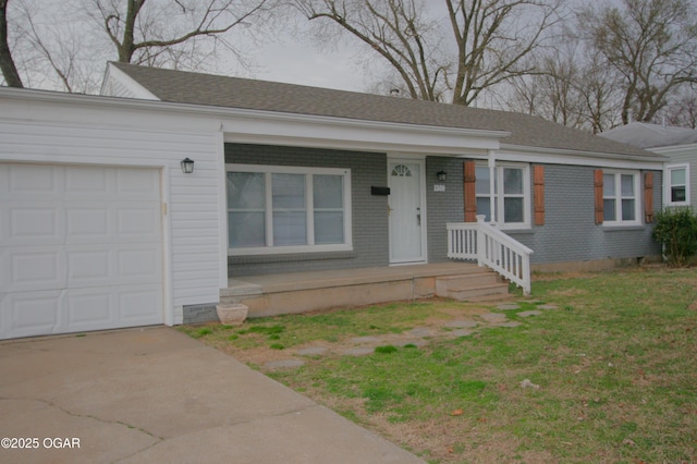 ranch-style house with concrete driveway, brick siding, and a garage