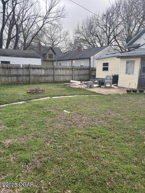 view of yard featuring a patio and a fenced backyard