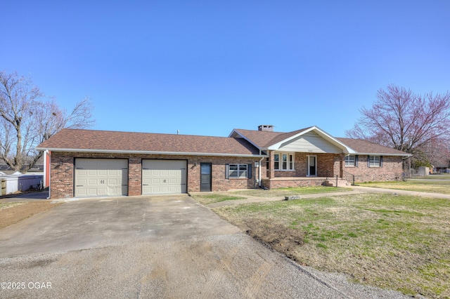 ranch-style home featuring brick siding, a front yard, roof with shingles, a garage, and driveway