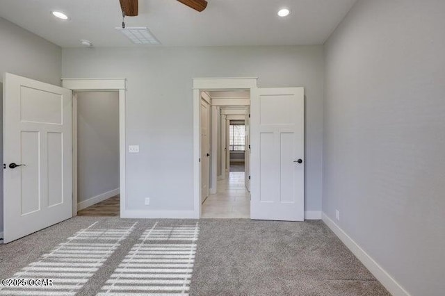 unfurnished bedroom with visible vents, recessed lighting, carpet, and baseboards