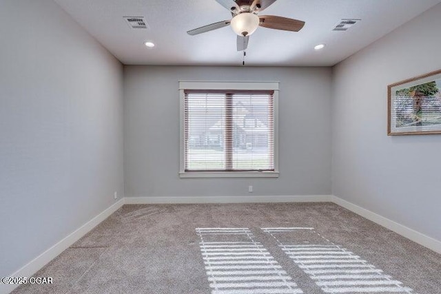 carpeted empty room featuring recessed lighting, visible vents, baseboards, and ceiling fan