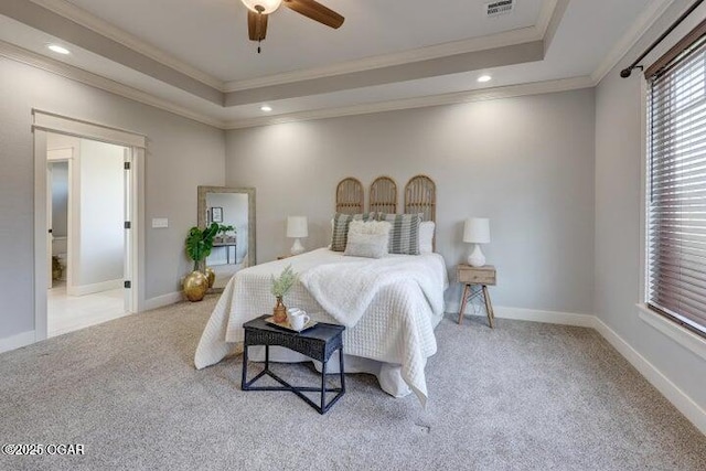 bedroom featuring carpet flooring, a raised ceiling, baseboards, and ornamental molding