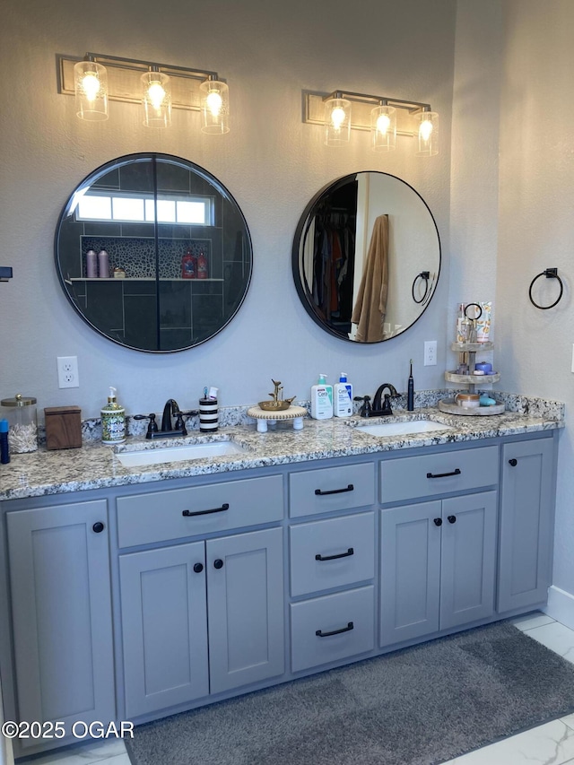 full bathroom featuring a sink and double vanity