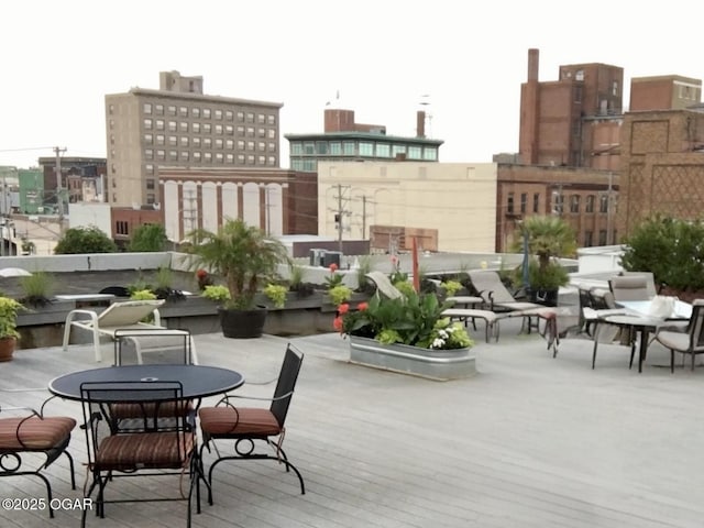 exterior space featuring outdoor dining space and a view of city