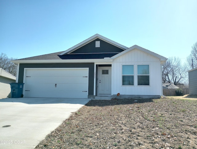 ranch-style house featuring a garage and concrete driveway