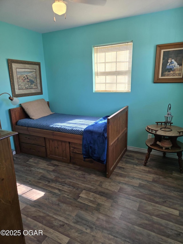 bedroom featuring ceiling fan and dark wood-style flooring