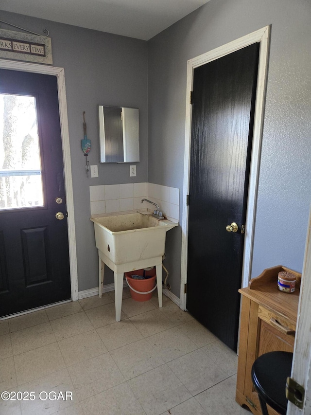 entrance foyer featuring baseboards