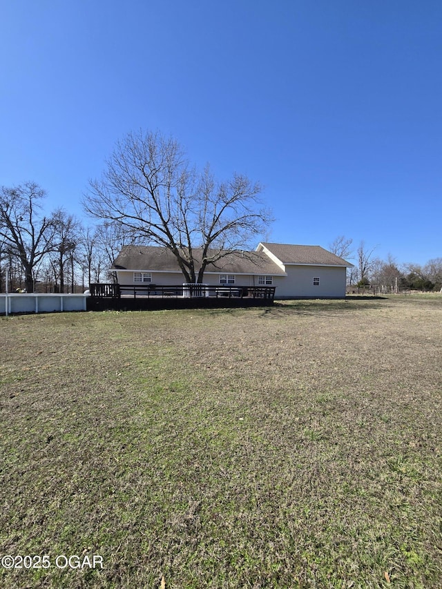 view of yard with a wooden deck