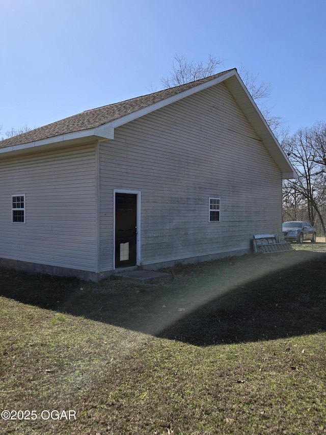 view of home's exterior with a lawn