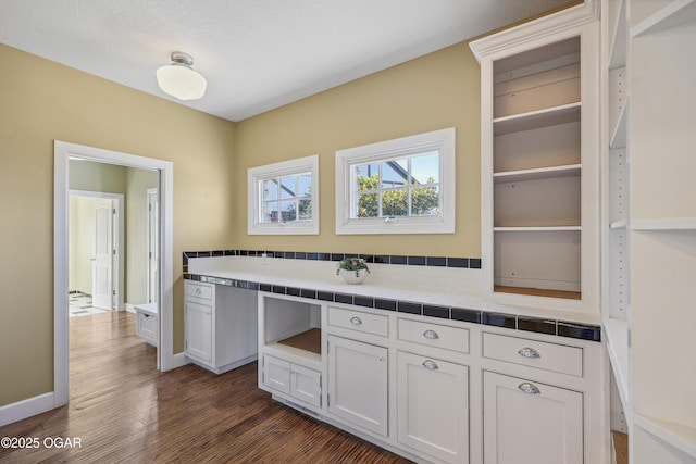 kitchen with tile countertops, baseboards, dark wood finished floors, open shelves, and white cabinets