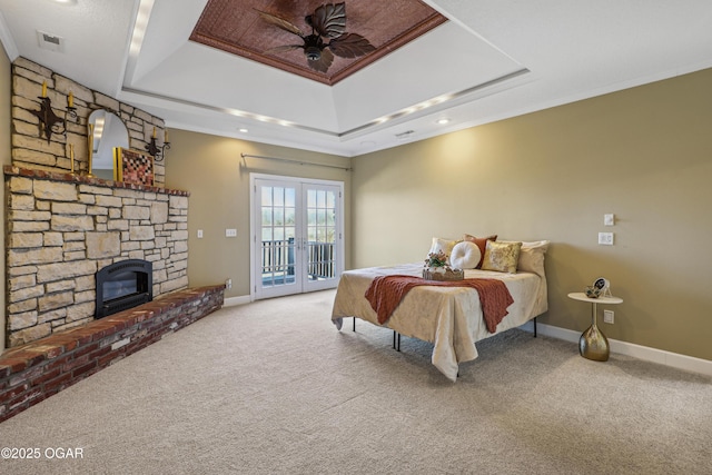 carpeted bedroom with visible vents, baseboards, french doors, a raised ceiling, and access to outside