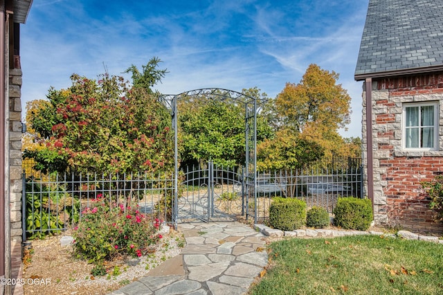 view of gate with fence