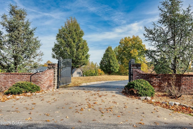 view of gate featuring fence