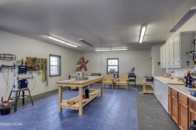 interior space featuring a sink and a workshop area