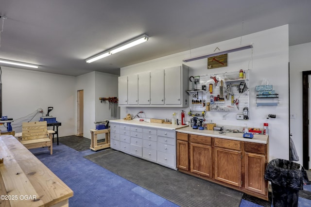 kitchen featuring brown cabinetry and light countertops