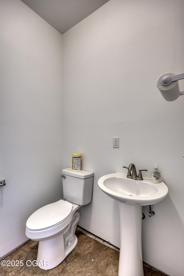 bathroom featuring toilet