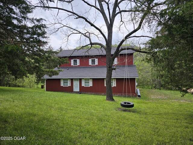2332 Packet Hollow Rd, Pineville, MO 64856 - view of front of home featuring a shingled roof and a front lawn