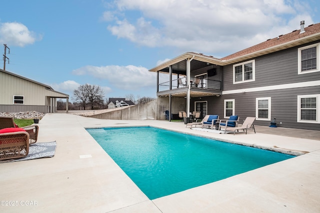 view of pool with a fenced in pool, fence, and a patio area