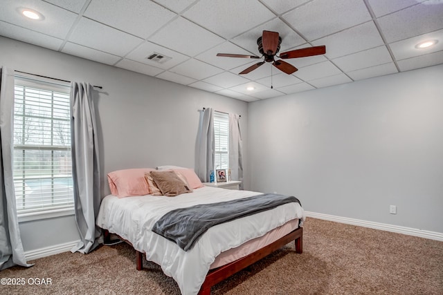 bedroom featuring visible vents, baseboards, and carpet