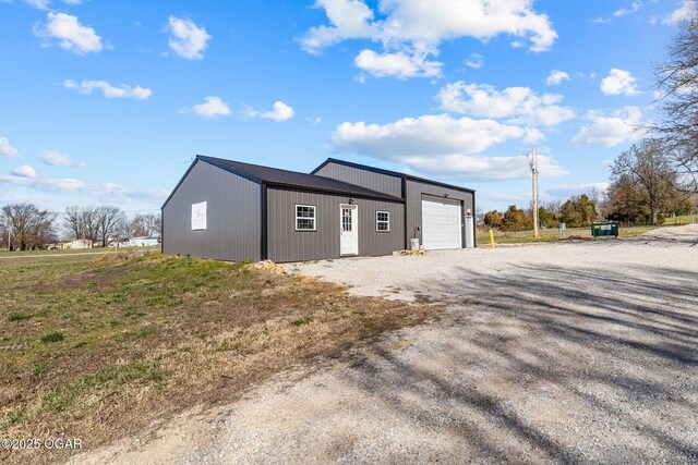 9426 Business 60, Monett, MO 65708 - exterior space featuring driveway, a detached garage, and an outbuilding