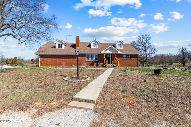 9426 Business 60, Monett, MO 65708 - view of front of property featuring brick siding, a chimney, and roof with shingles