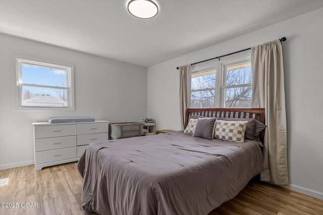 9426 Business 60, Monett, MO 65708 - bedroom featuring baseboards and light wood-style floors