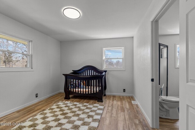 9426 Business 60, Monett, MO 65708 - bedroom with baseboards and light wood-style floors