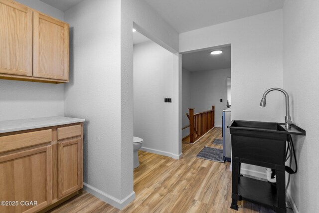 9426 Business 60, Monett, MO 65708 - bathroom with baseboards, wood finished floors, and toilet