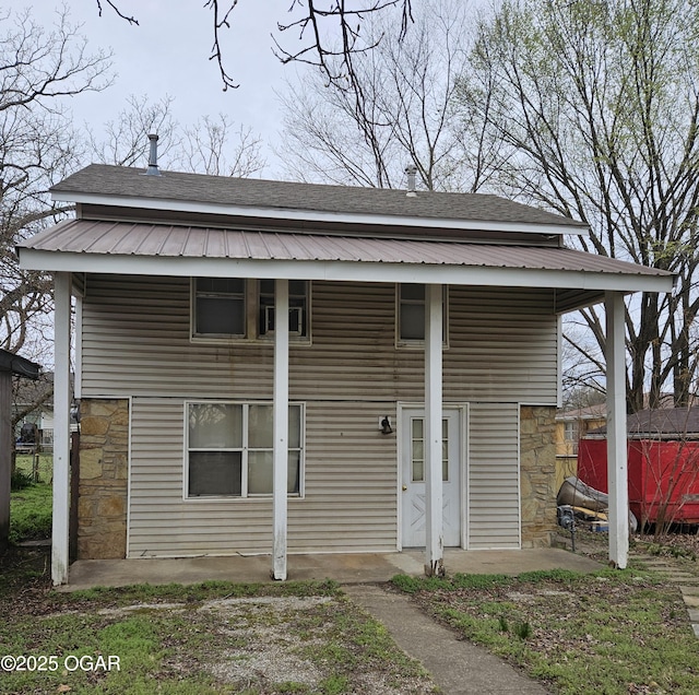 906 Randolph St, Neosho, MO 64850 - view of front of house with stone siding and roof with shingles