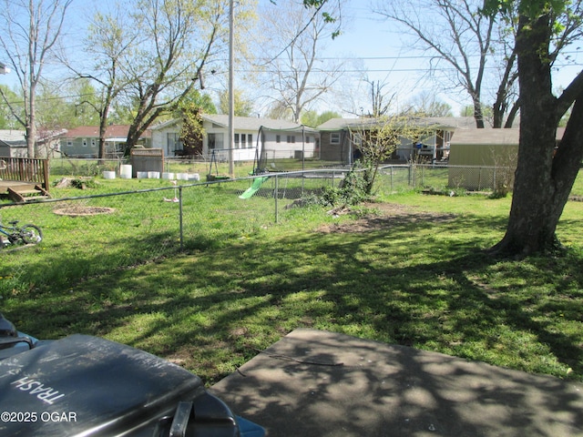 view of yard with fence and a residential view