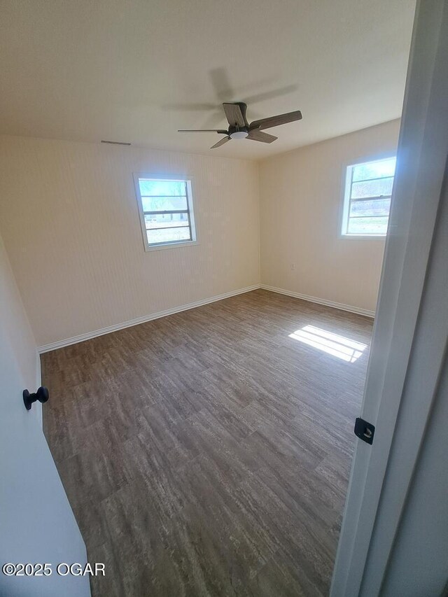 514 S Cole, Granby, MO 64844 - unfurnished room with baseboards, wood finished floors, and a ceiling fan