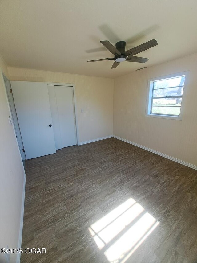 514 S Cole, Granby, MO 64844 - unfurnished room with baseboards, wood finished floors, and a ceiling fan