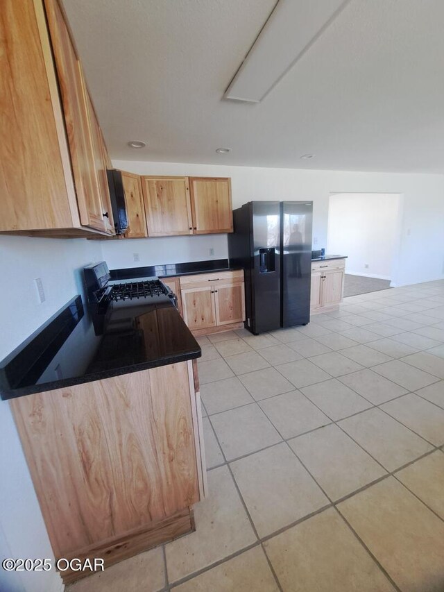 514 S Cole, Granby, MO 64844 - kitchen with dark countertops, black appliances, and light tile patterned floors