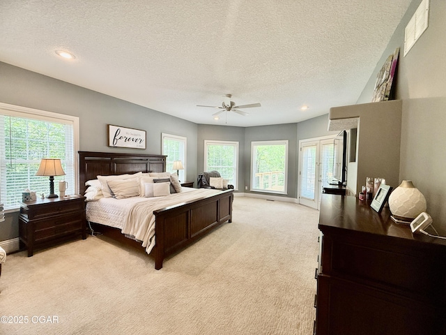 bedroom featuring light colored carpet, a textured ceiling, ceiling fan, baseboards, and recessed lighting