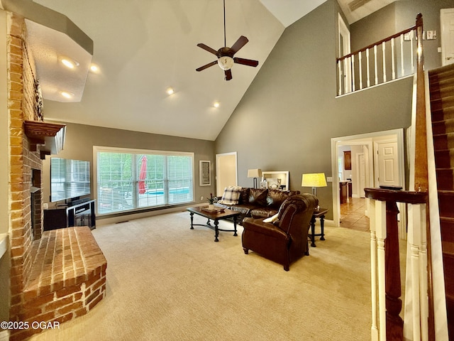 living room featuring high vaulted ceiling, carpet, a fireplace, a ceiling fan, and recessed lighting