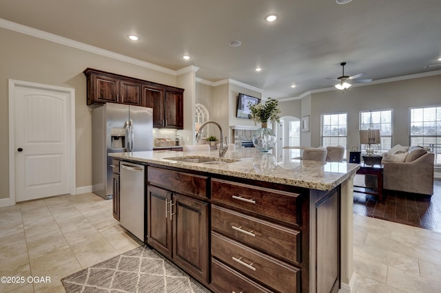 kitchen featuring a ceiling fan, a sink, appliances with stainless steel finishes, and recessed lighting