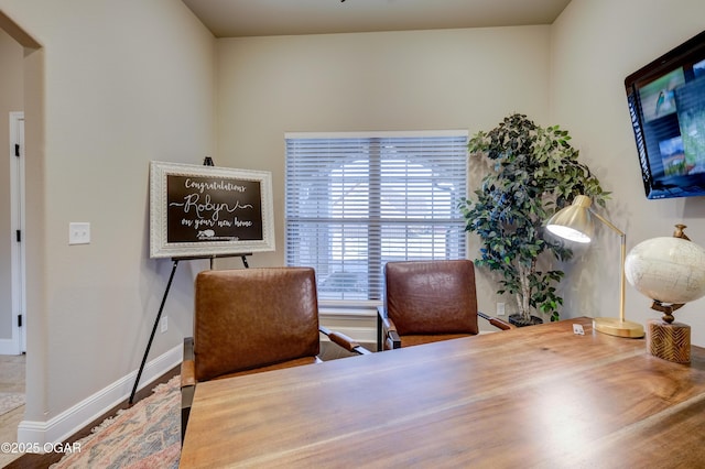 office space with baseboards